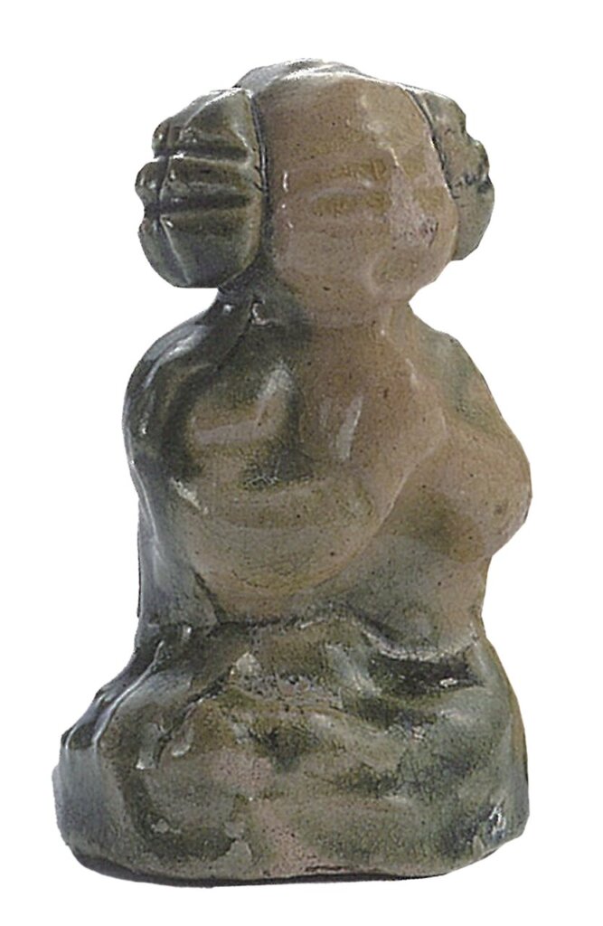 〈女禮佛俑〉。