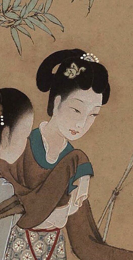 仕女臉部的水漬痕跡修復前後對比。