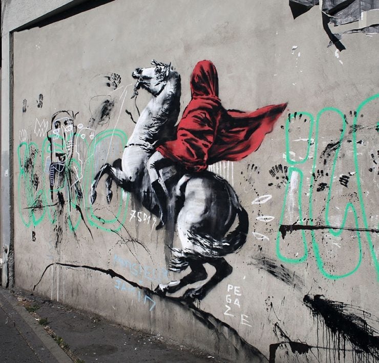 2MN40R2 A graffiti believed to be attributed to street artist Banksy is seen on a wall along a street in Paris, Monday,…